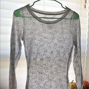 A white long sleeve with horse shoes